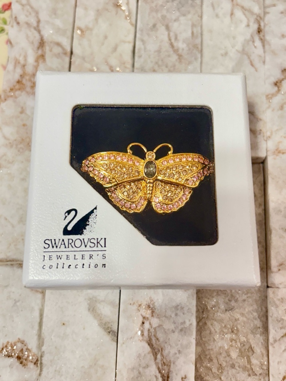 Vintage retired Swarovski pave butterfly brooch pin.